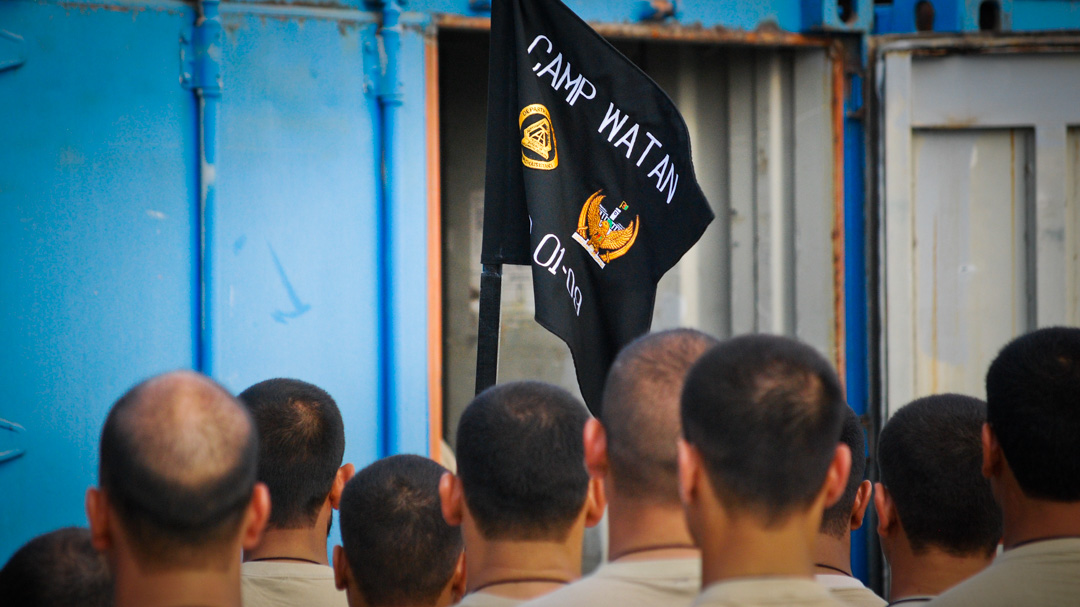 Afghan Presidential Protection Service candidates facing the guidon of Camp Watan, in Kabul Afghanistan. Photographed by 8d Photos based in Clermont, Florida, USA.