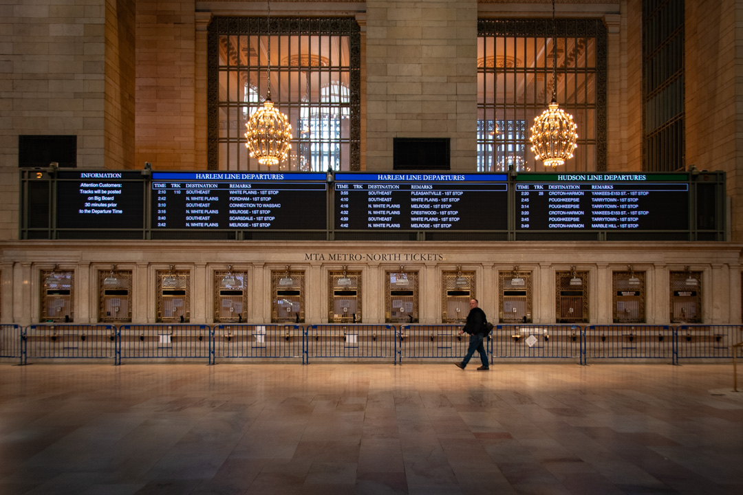 A single person walking through Grand Central Station, in New York City, New York. Taken during the Covid-19 Pandemic lockdown in 2020.