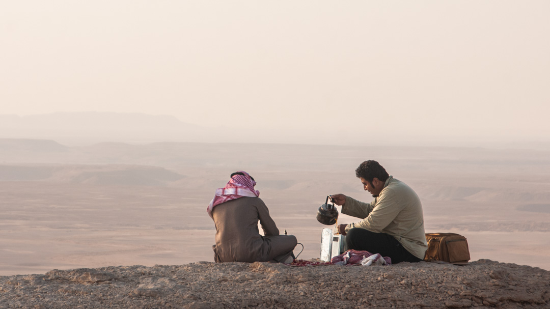 Two men Take a Tea Break at the Edge of the World, Saudi Arabia. Photographed by 8d Photos based in Clermont, Florida, USA.